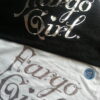 Fargo Girl® Black Tee with sliver foil
